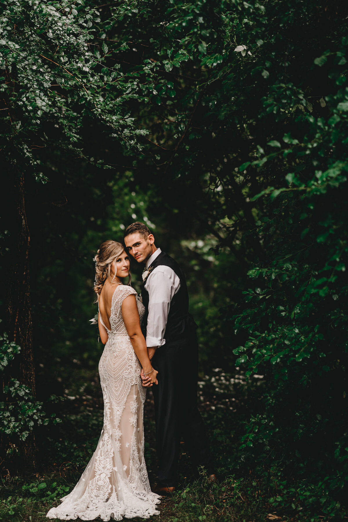 Bride and groom holding hands