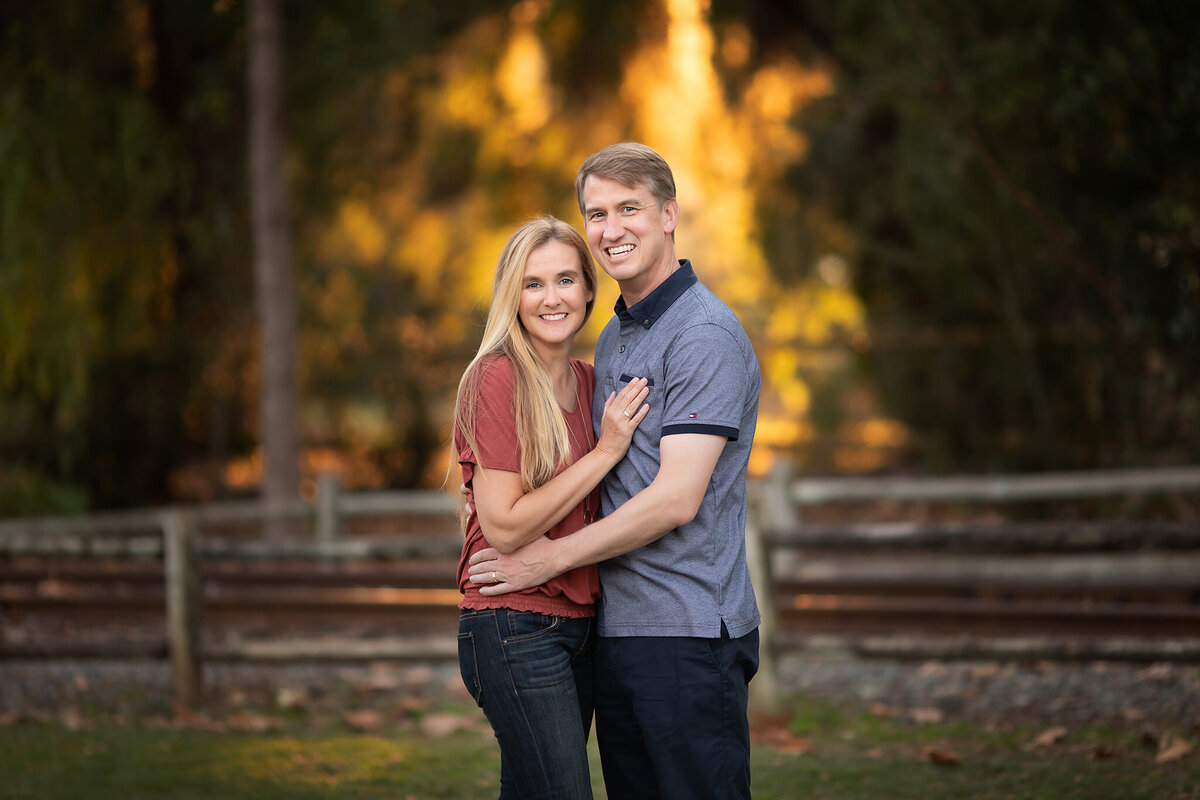 A couple enjoying a moment together, captured by a Dallas family photographer in a beautiful outdoor setting.