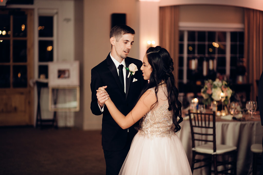 Wedding Photograph Of Groom In Black Suit Dancing With a Woman In White Dress Los Angeles