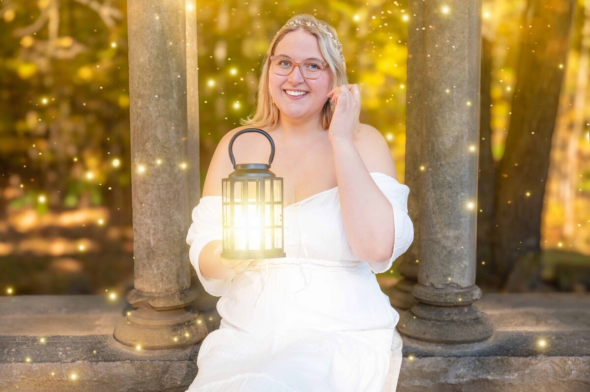 The Fairy Godmother of Brand Storytelling Chantal holding out a glowing lantern to share her light in Gatineau Park