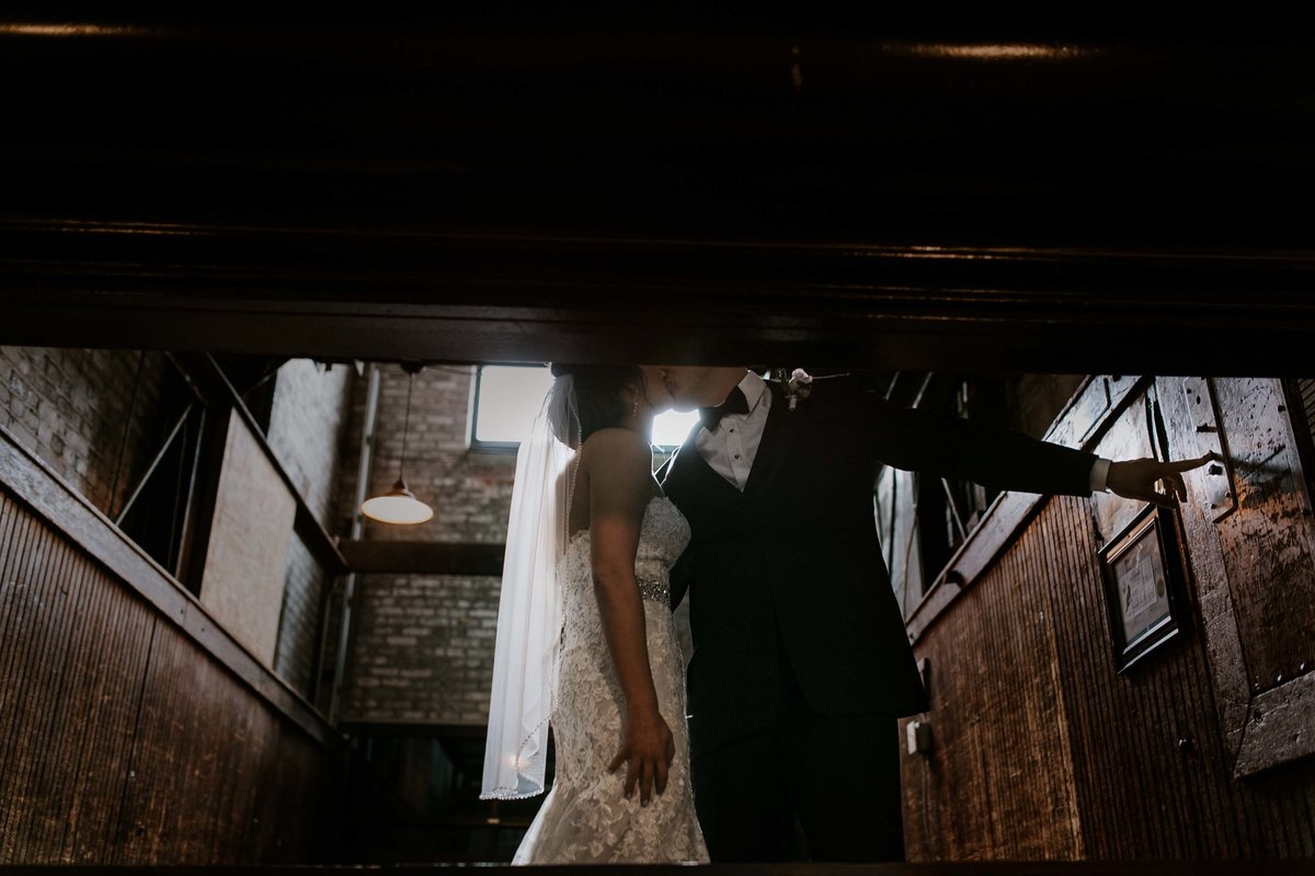 Bride and groom go up in service elevator towards their Biltwell Wedding in indianapolis
