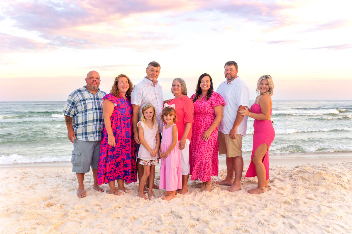 Grandparents children and grandchildren in group photo for beach session