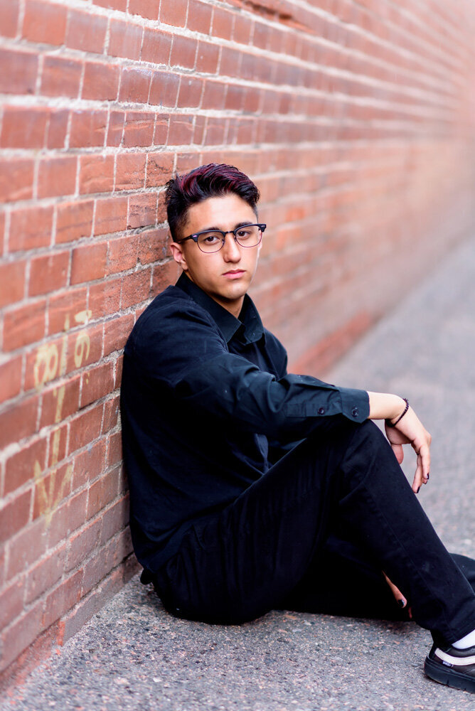 boy-high-school-senior-in-alley-urban-with-red-brick-littleton