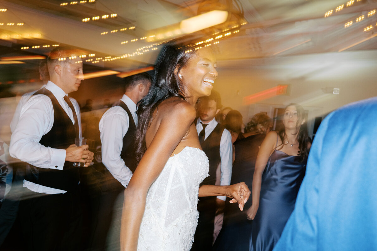 Best man jumps over six people laying down on dancefloor at Glen Foerd Estate in Philadelphia, PA