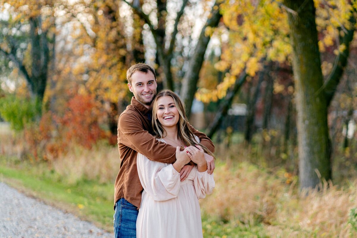 bride-groom-to-be-smiling-fall-session