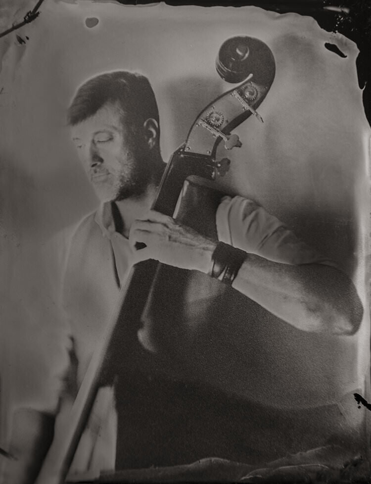 A photo of a person playing cello