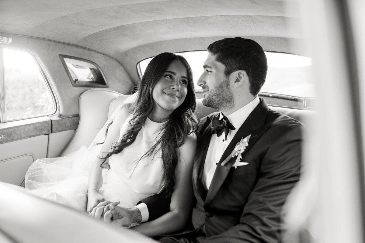 bride and groom just married in rolls royce