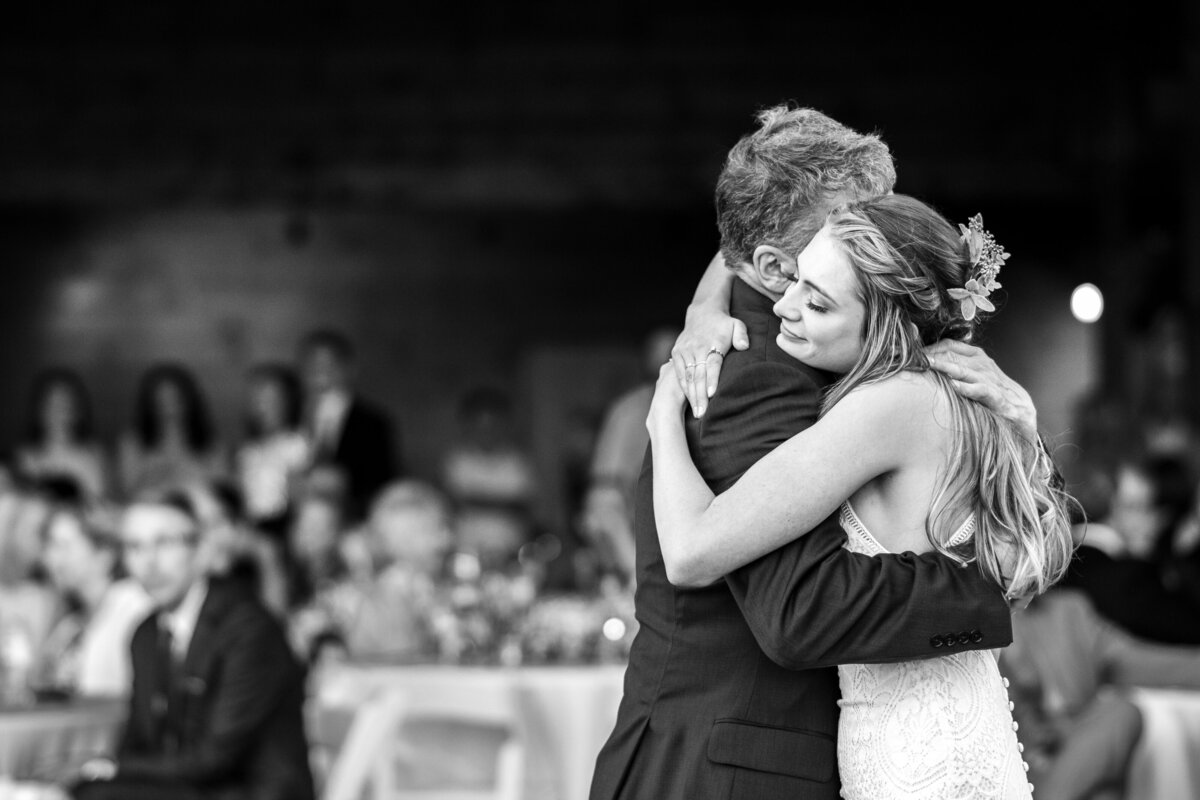 Bride and her father embrace one another during the father daughter dance. Wedding reception at Meadow Ridge Events. Photographed by Cleveland Wedding photographer Aaron Aldhizer