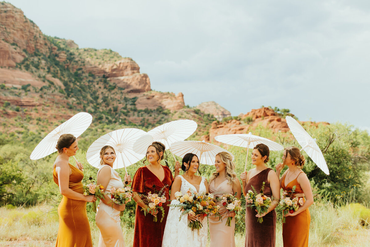 bridesmaids with parasols for wedding photos