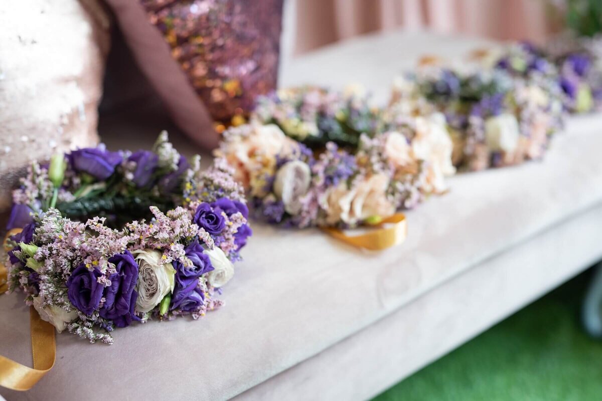 Floral crowns sat on a white sofa