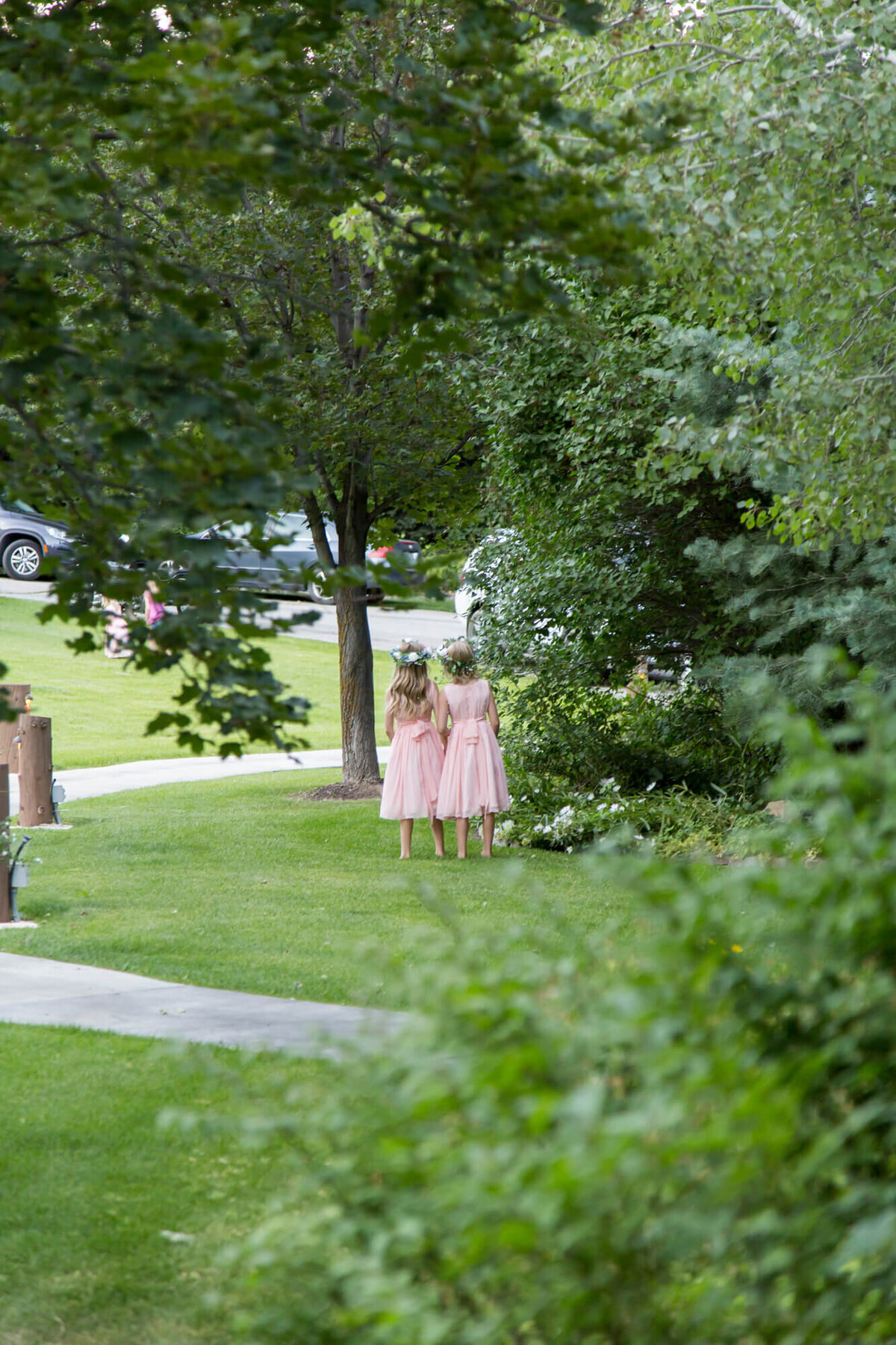 two little girls in pink dresses