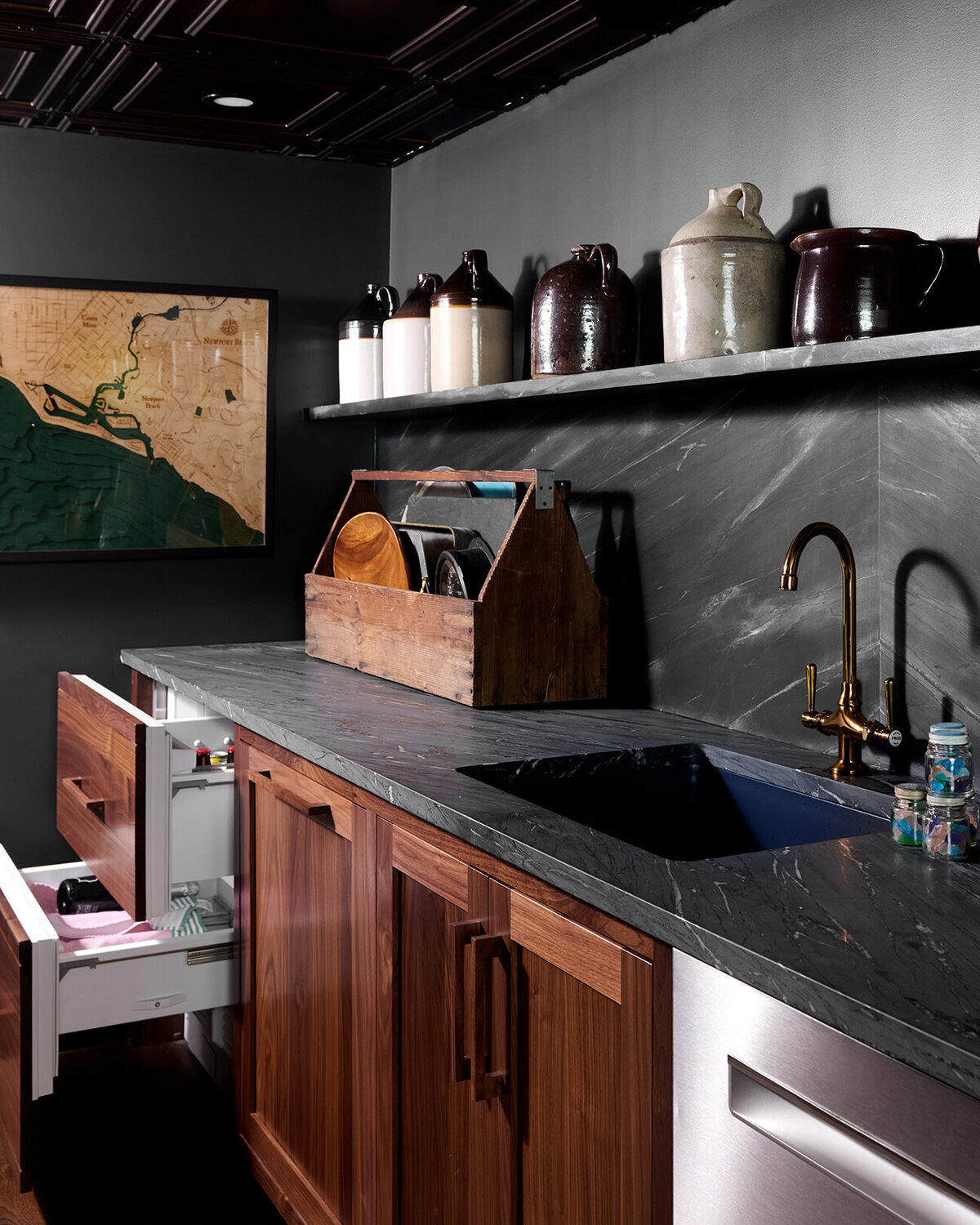 dark gray kitchen counter with wooden undersink cabinet