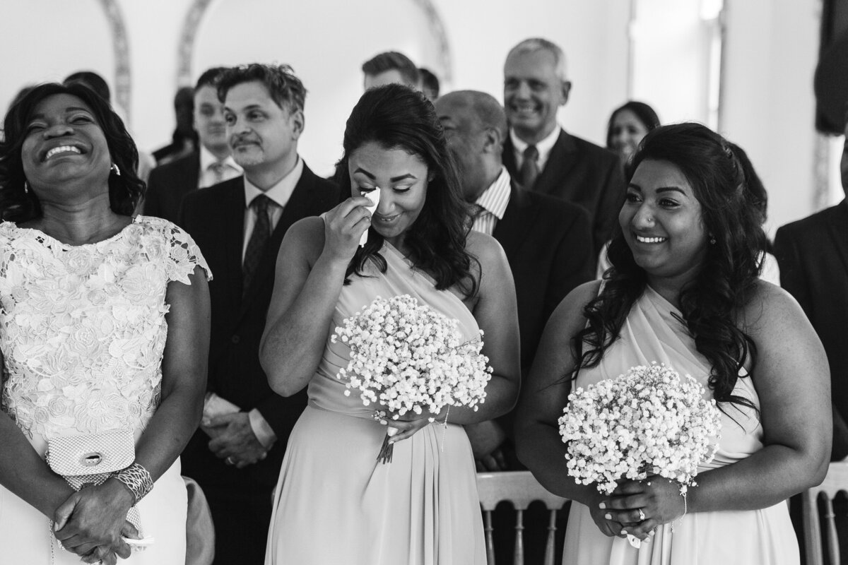 documentary moment of bridesmaid crying at wedding during the cereomony