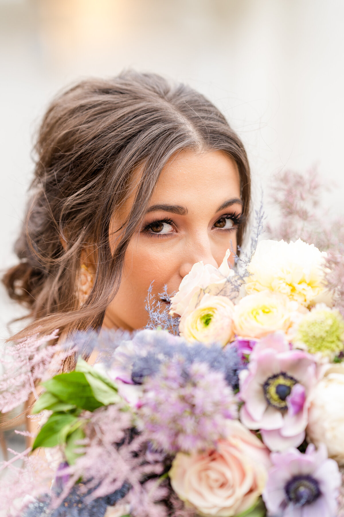 Bride smiling with colorful bouquet at Peach Orchard venue in Houston, Texas