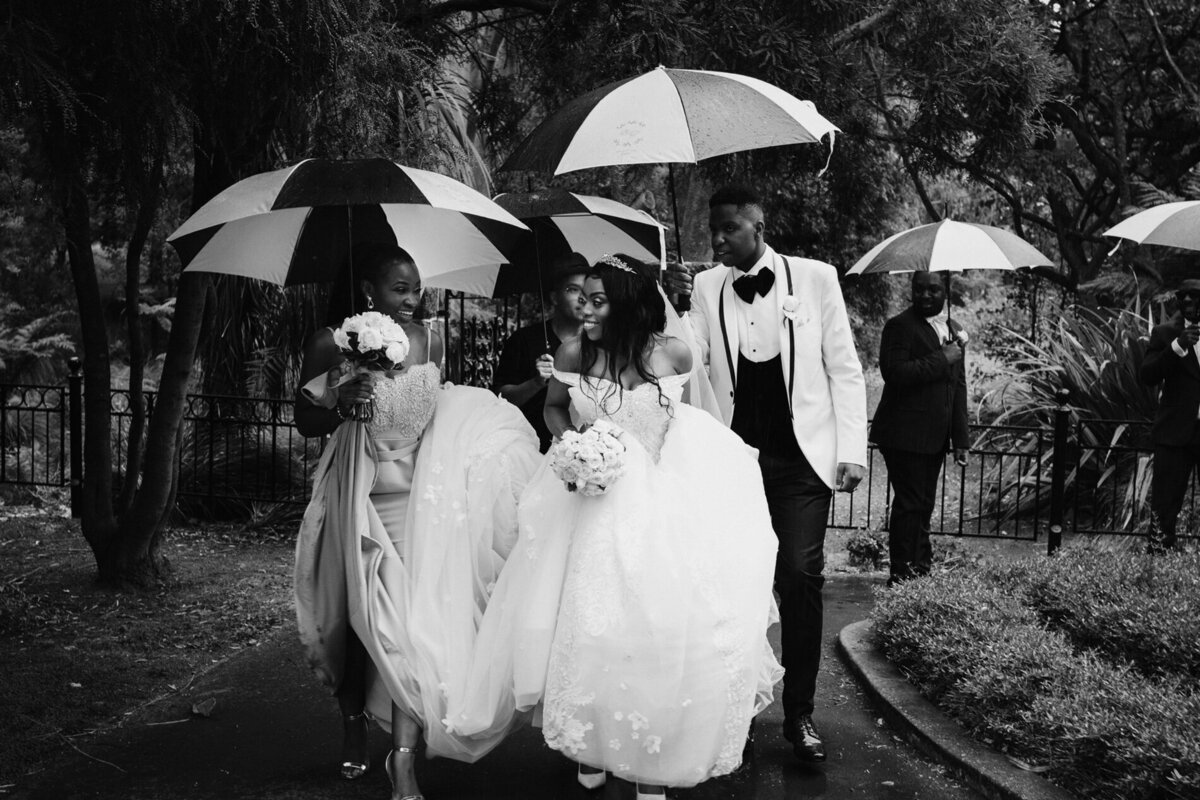 Bride & Groom  Wedding party  photos in the rain at Chayeau on the Park by Tracey Allsopp Photography