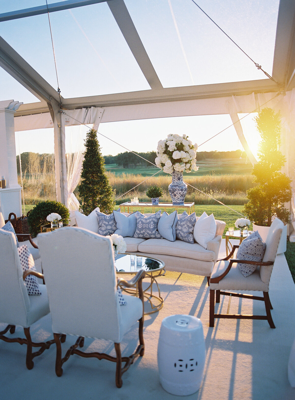 A picture of the outdoor seating area of the wedding at the Onwentsia country club. 