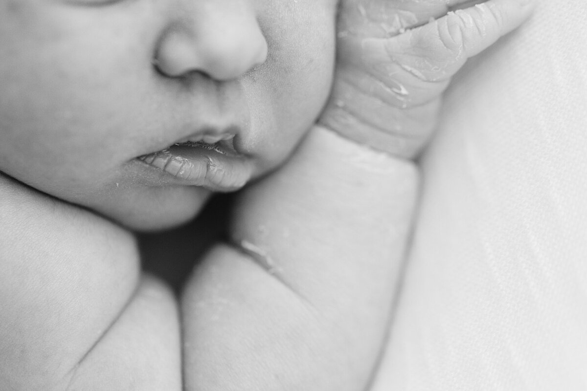 close up photo of sleeping newborn baby's mouth during newborn pictures with Tiffany Hix Photography in Boise