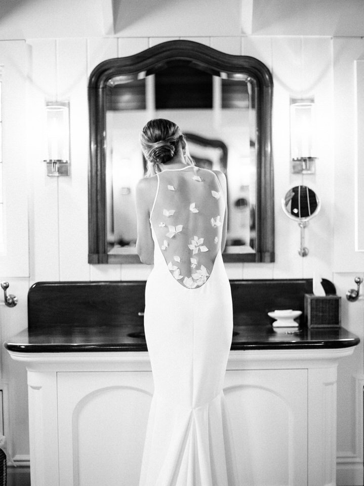 black and white photo of bride getting ready