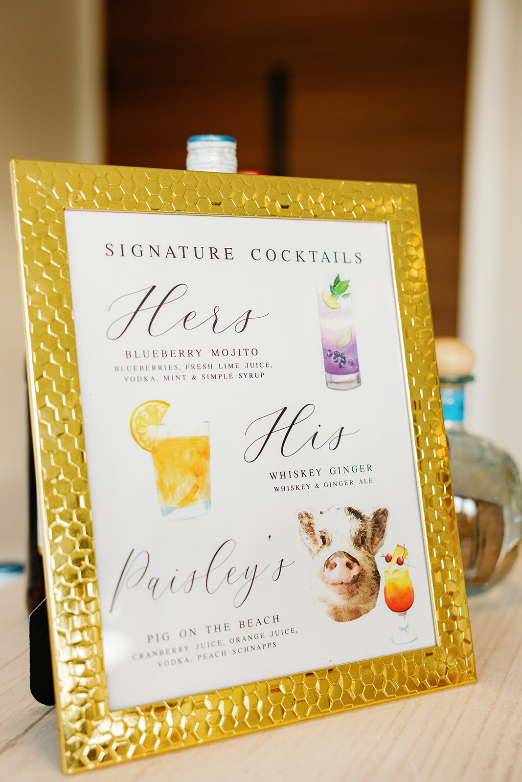  Signature cocktail sign showcasing special drinks named after the couple and their pet.