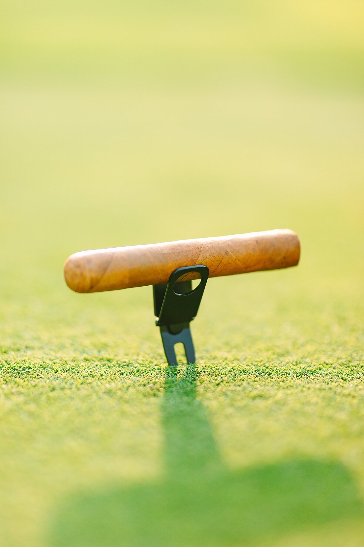 Golf ball marker and cigar holder product photography session on a golf course green in San Marcos, California.