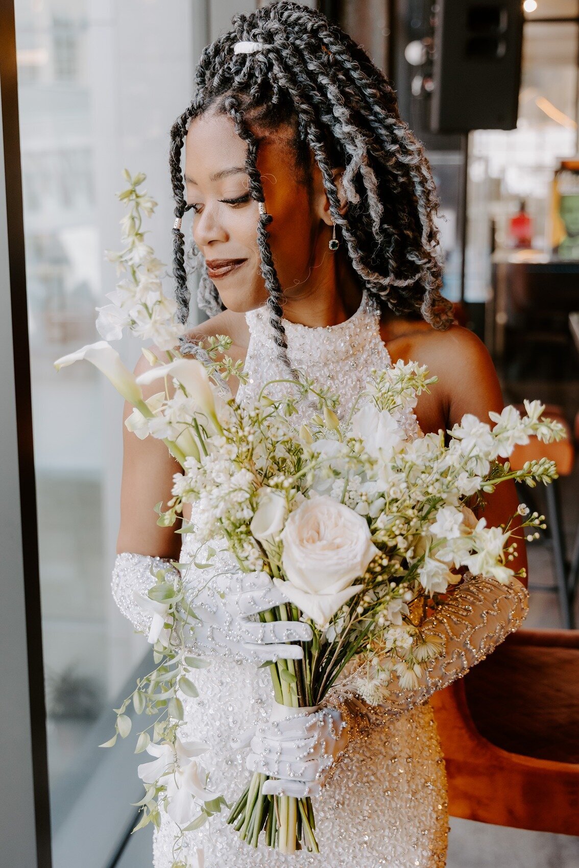 Bride holding her white wedding bouquet
