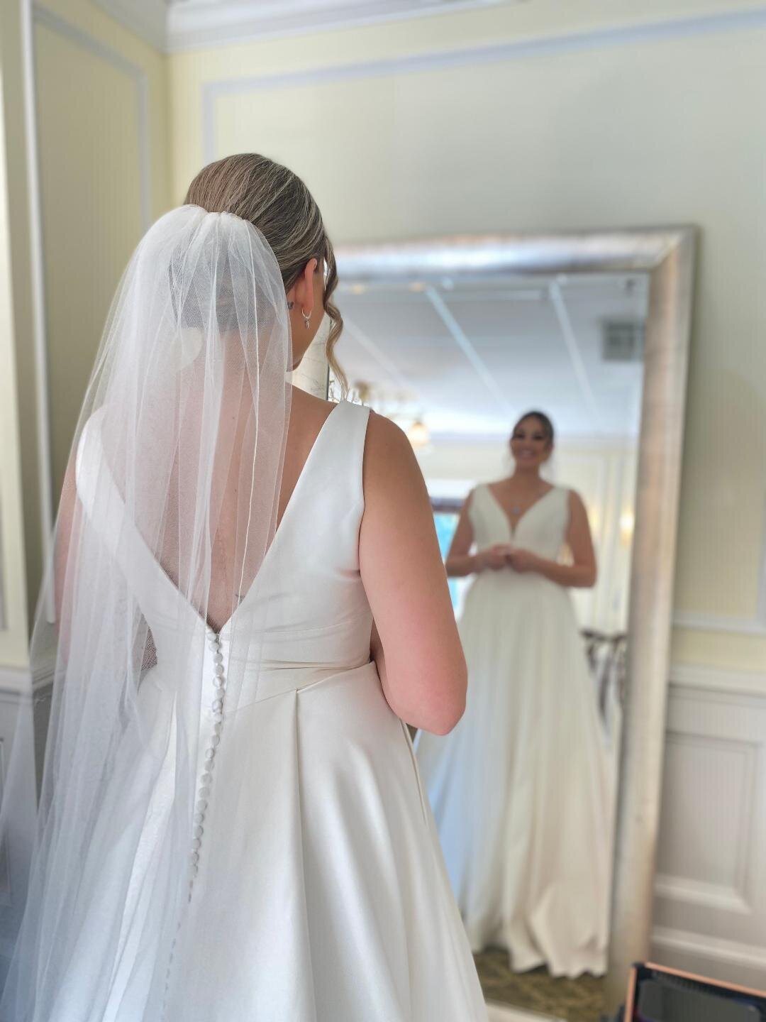 Bride looking in mirror