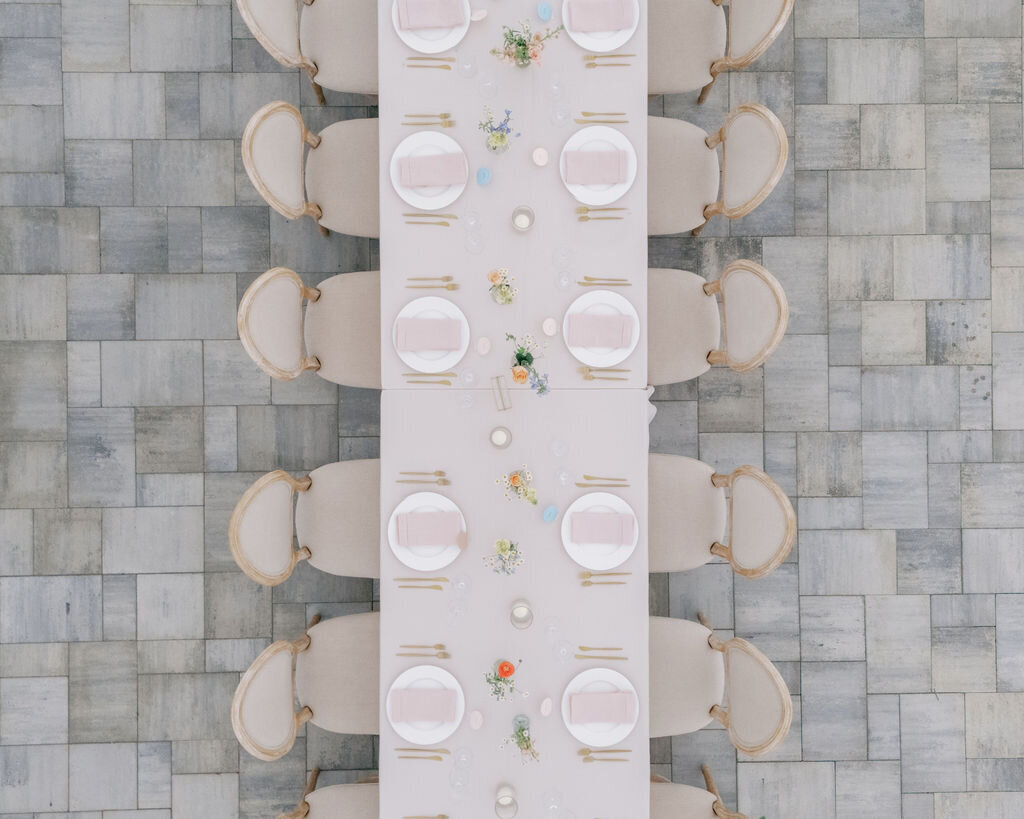 Overhead view of a long table on the stone tent pad