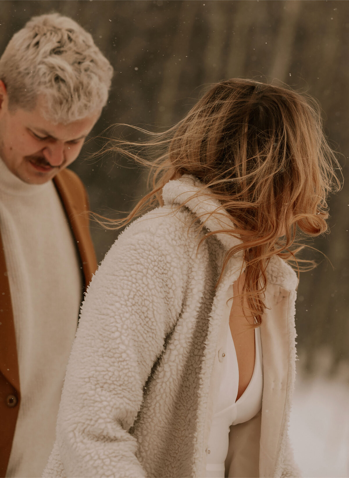 bride and groom walk together on their elopement day on a snowy winter day in Bend, Oregon