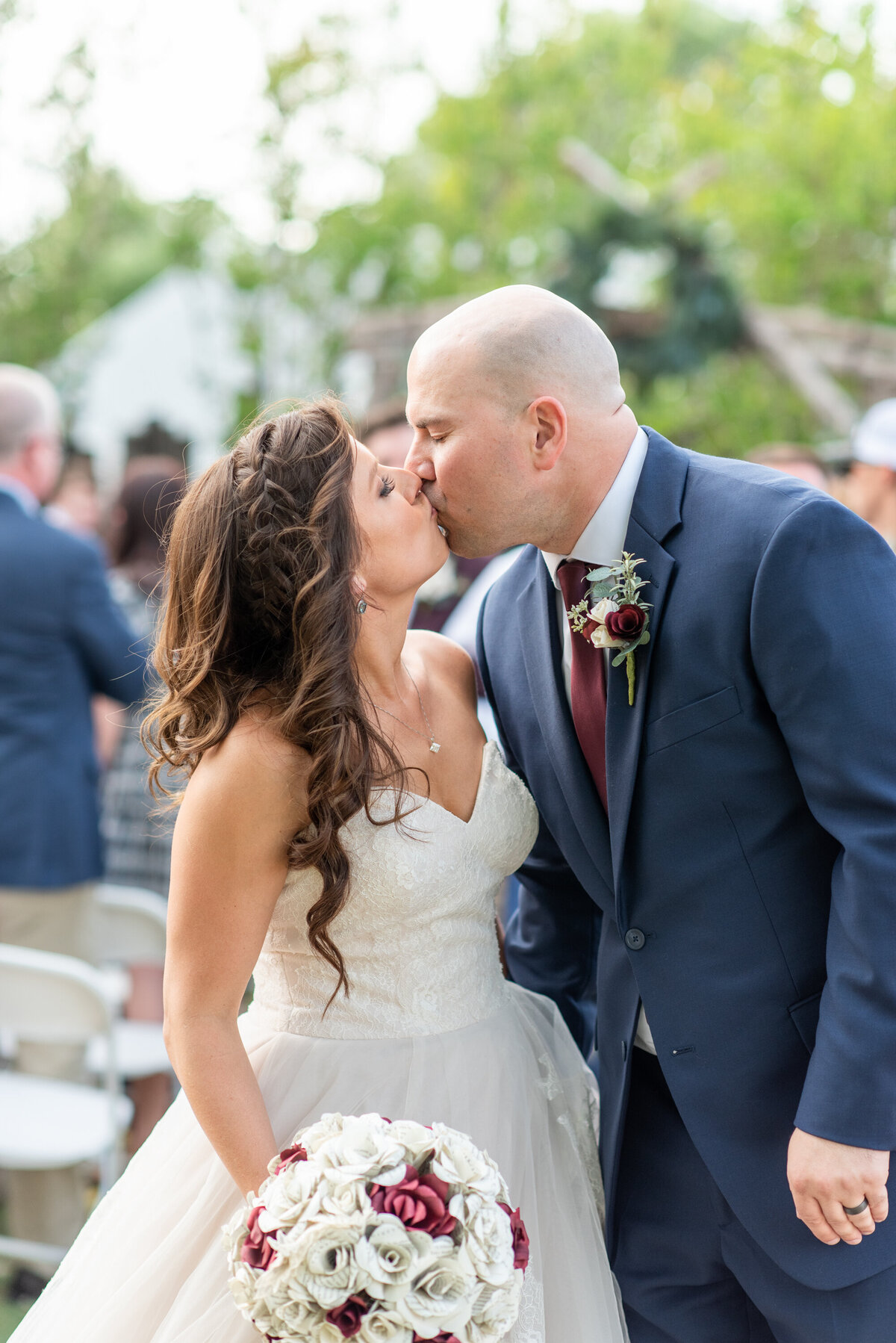 bride and groom kissing after ceremony