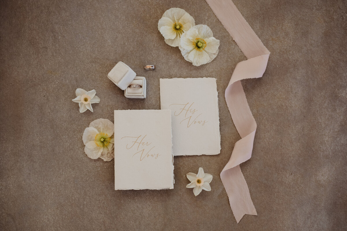 Utah Elopement Photographer captures elopement details with pink ribbon in flatlay