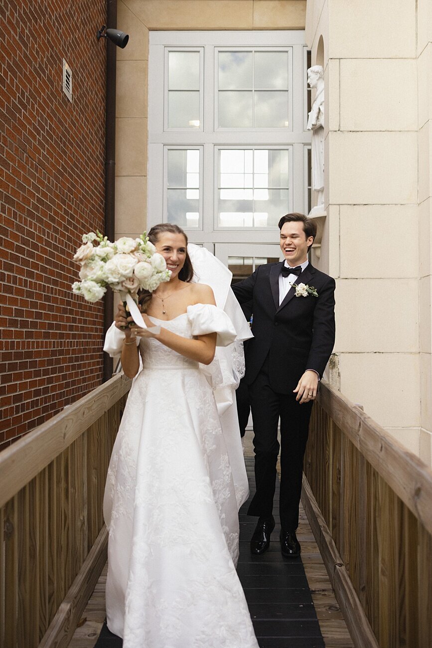 bride and groom walking out of church