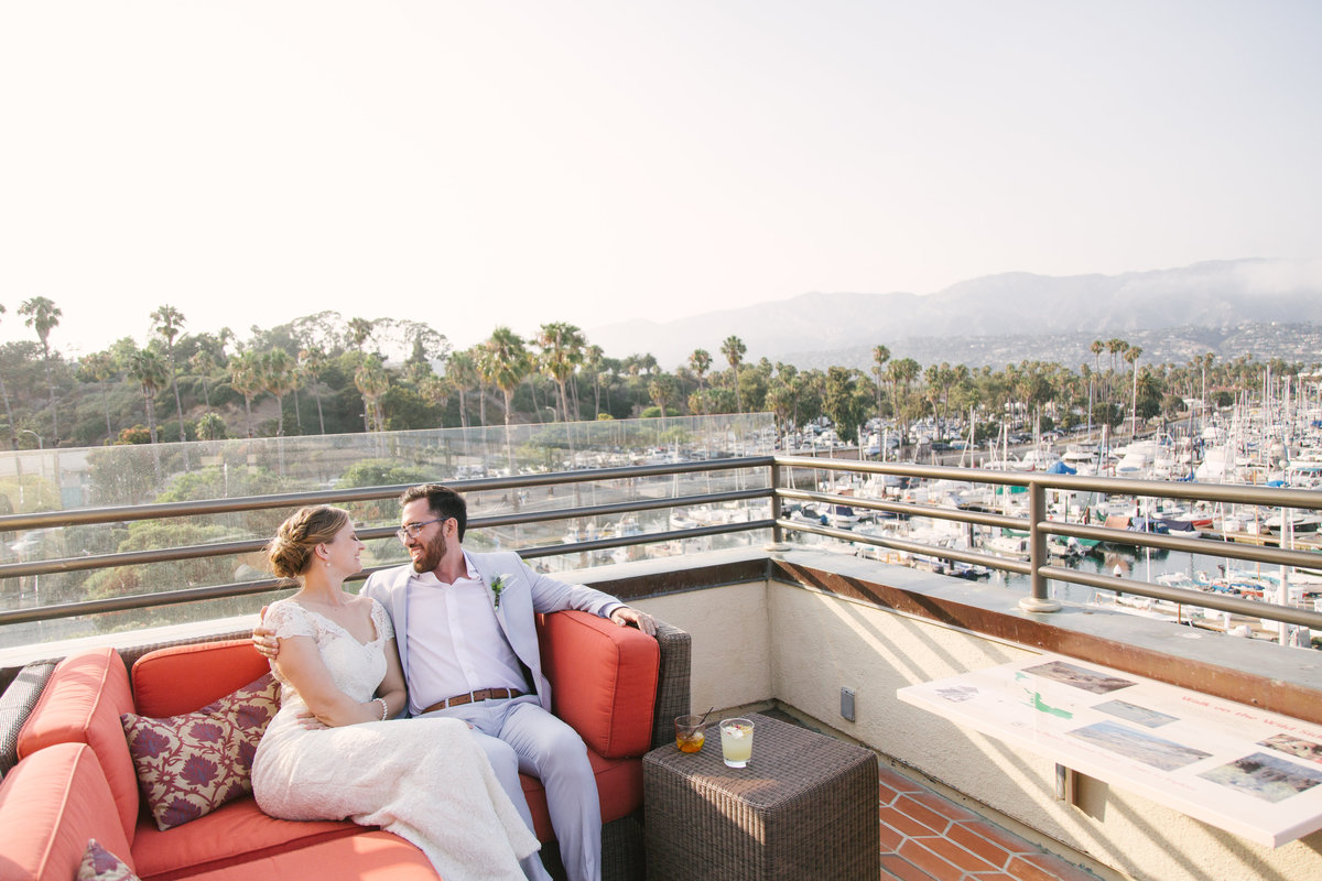 Bride and groom overlook harbor at Santa Barbara Maritime Museum wedding