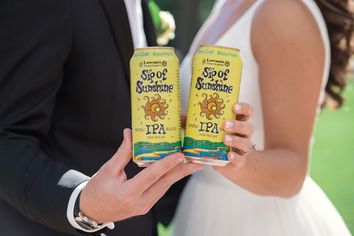 bride and groom holding Sip of Sunshine at Stonebridge Country Club