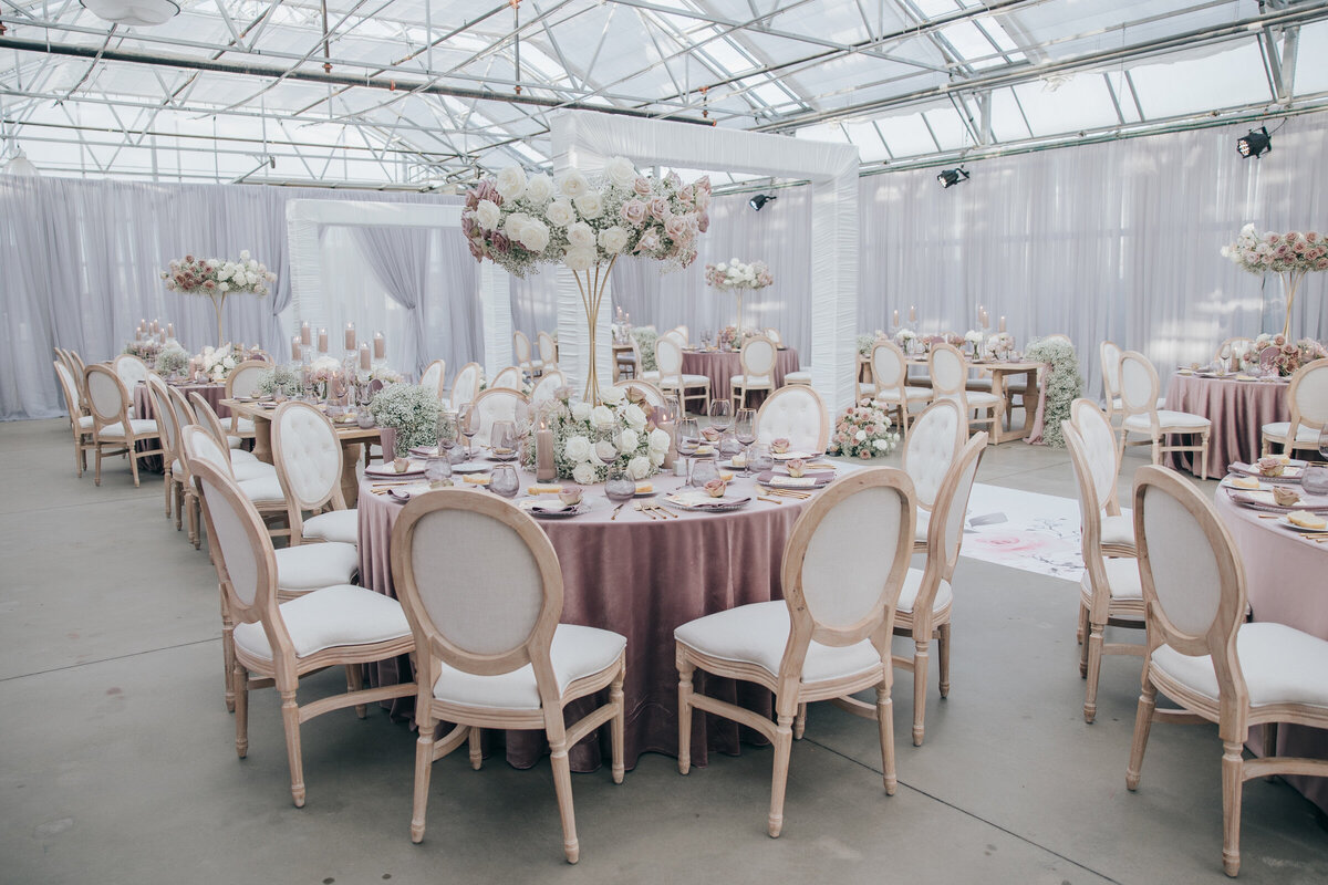 Glamorous indoor dinning for ivory and lavender themed wedding at Twelfth Night Events