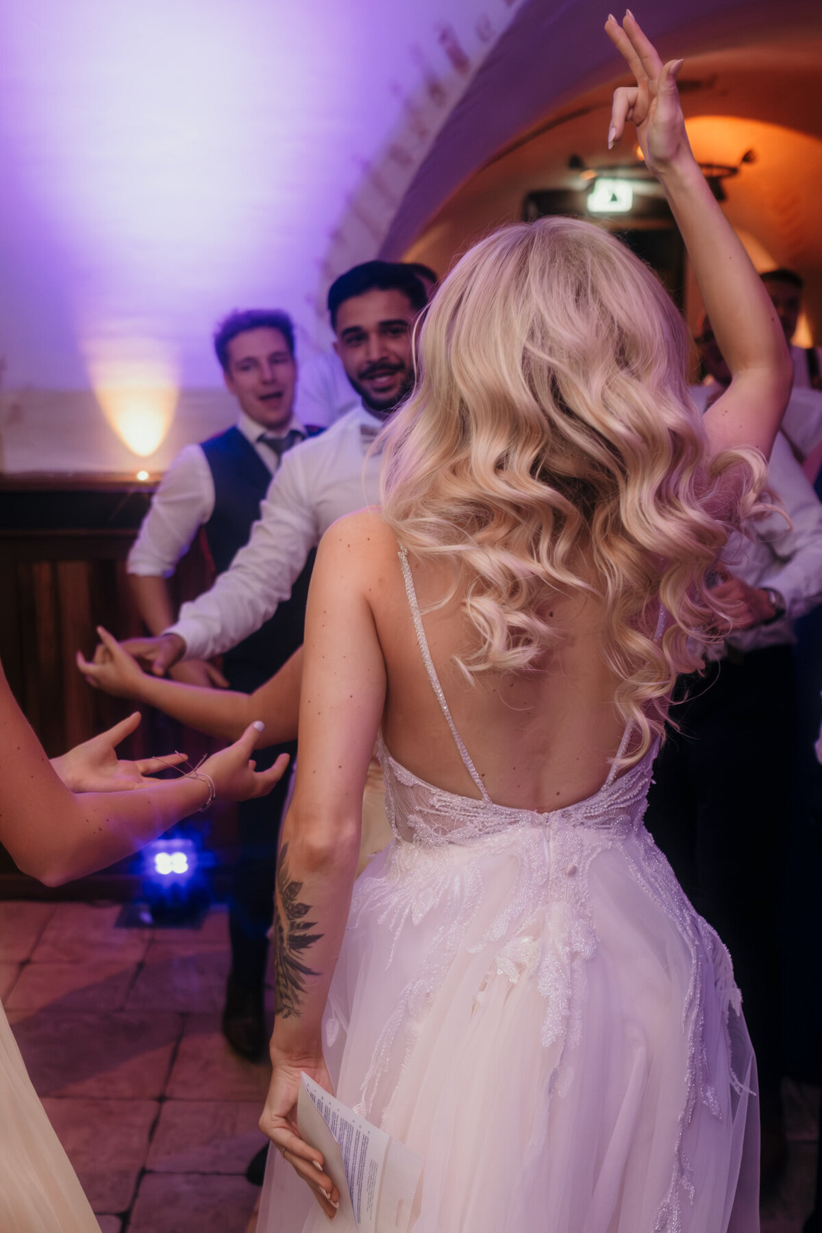 The bride dances during her wedding party, cleberating her big day with all her loved ones.