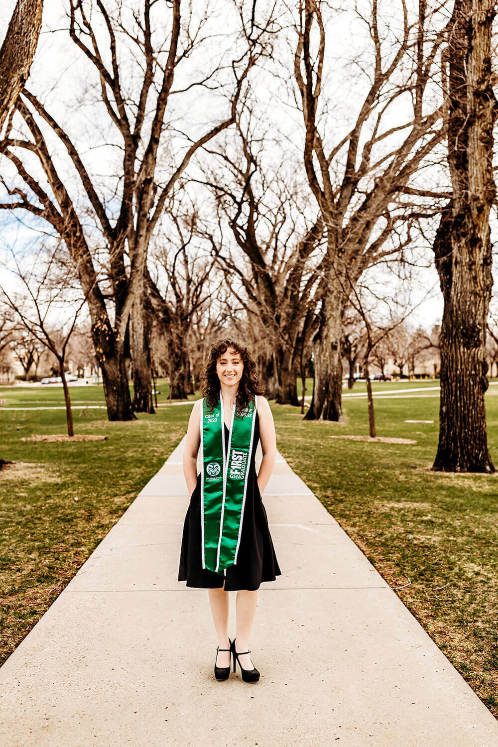 Colorado State University graduate with stole on CSU campus.