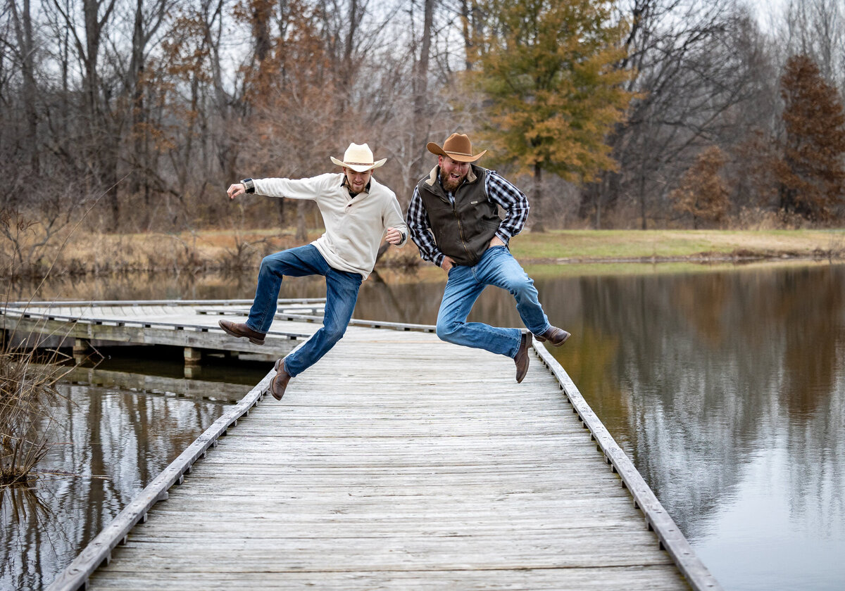 Two guys jumping on the bridge