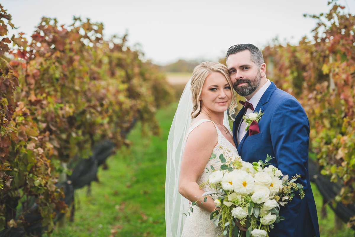 photo of bride and groom in the vineyards from wedding at The Vineyards at Aquebogue