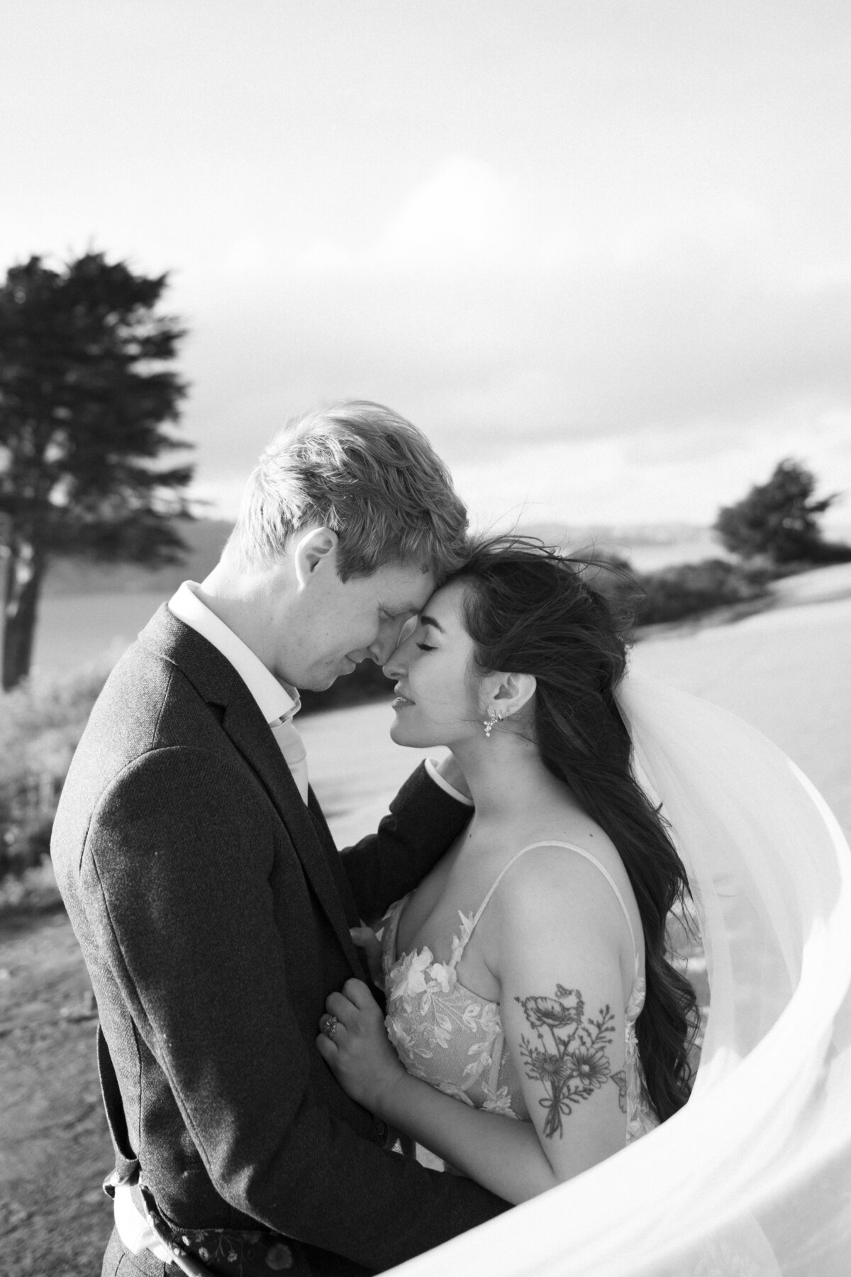 Bride and Groom at Marshall's Beach in San Francisco, California at sunset