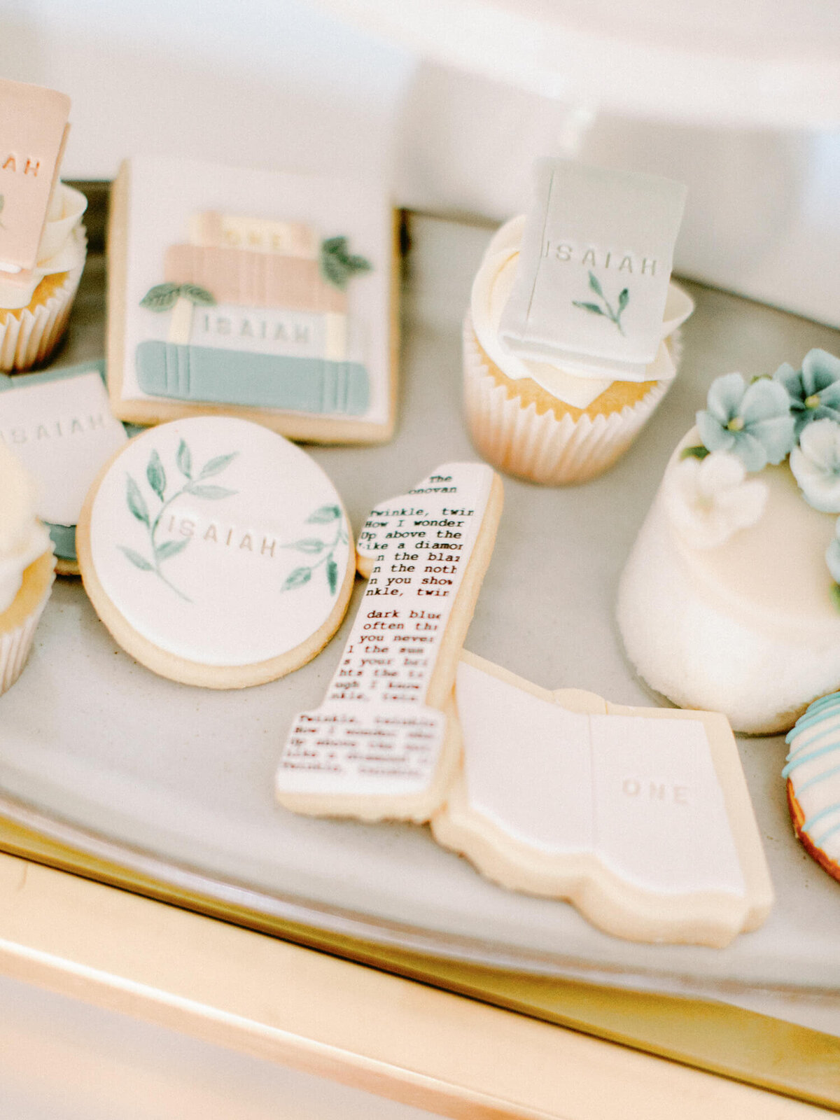 library and book themed korean first birthday cupcakes and cookies with isaiah stamped on them