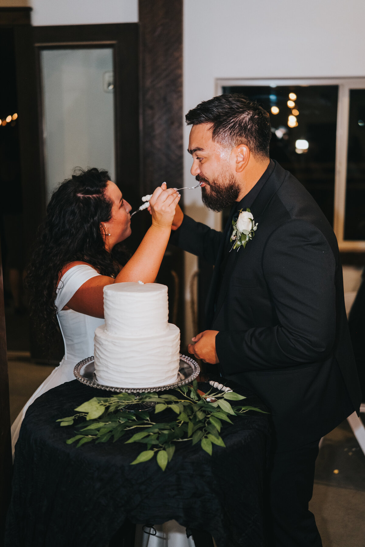 Couple cutting their wedding cake