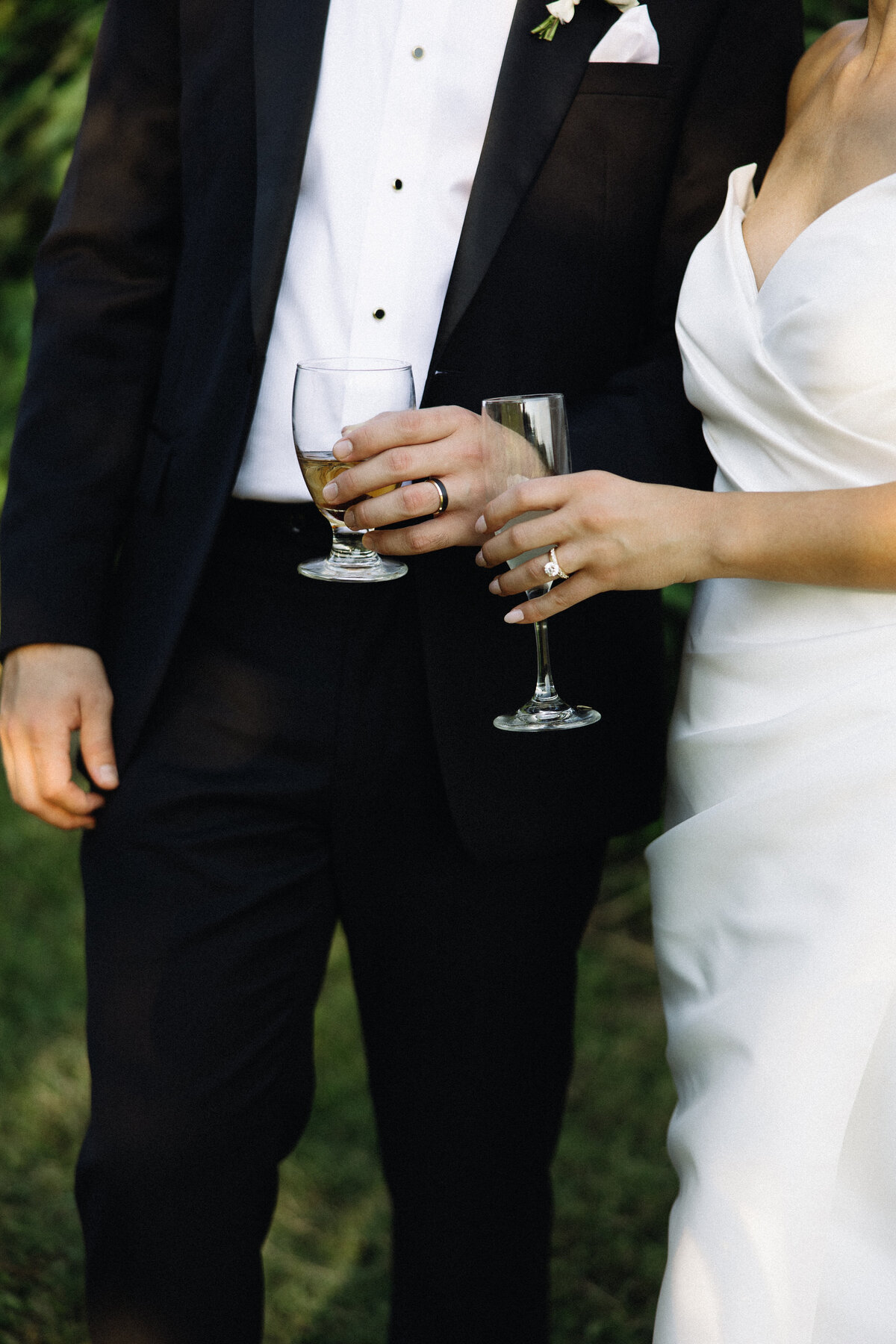 Couple raising glasses of champagne, celebrating their wedding day, captured by an Atlanta wedding photographer.