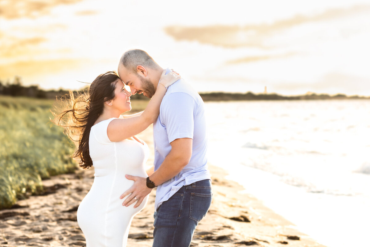 Couple-embracing-Robert Moses Beach-pregnancy