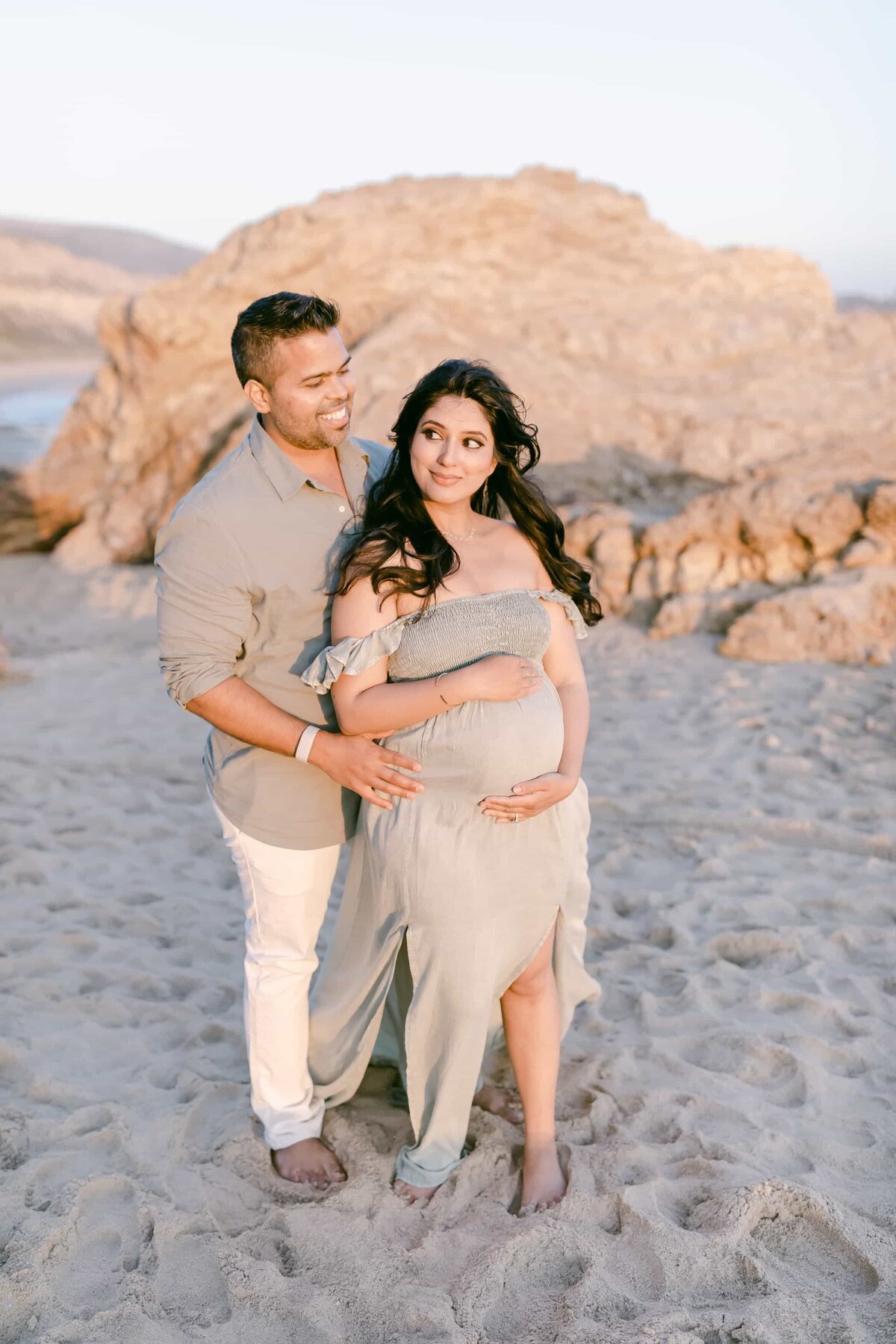 Orange County Maternity Photographer - couple during a maternity session at sunset in mint muted green