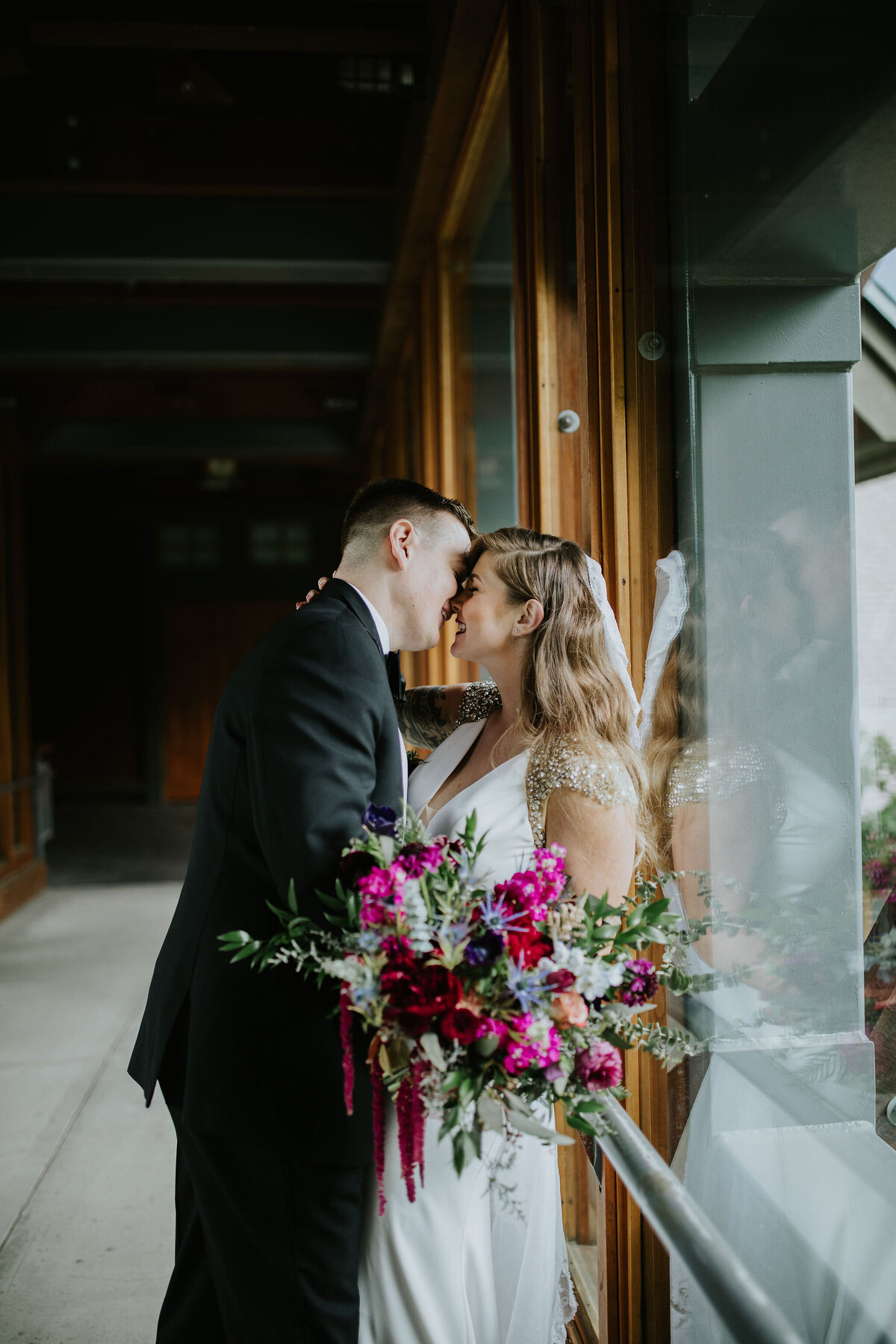 bride and groom with custom floral bouquet at Nita Lake Lodge Whistler wedding - Within the Flowers