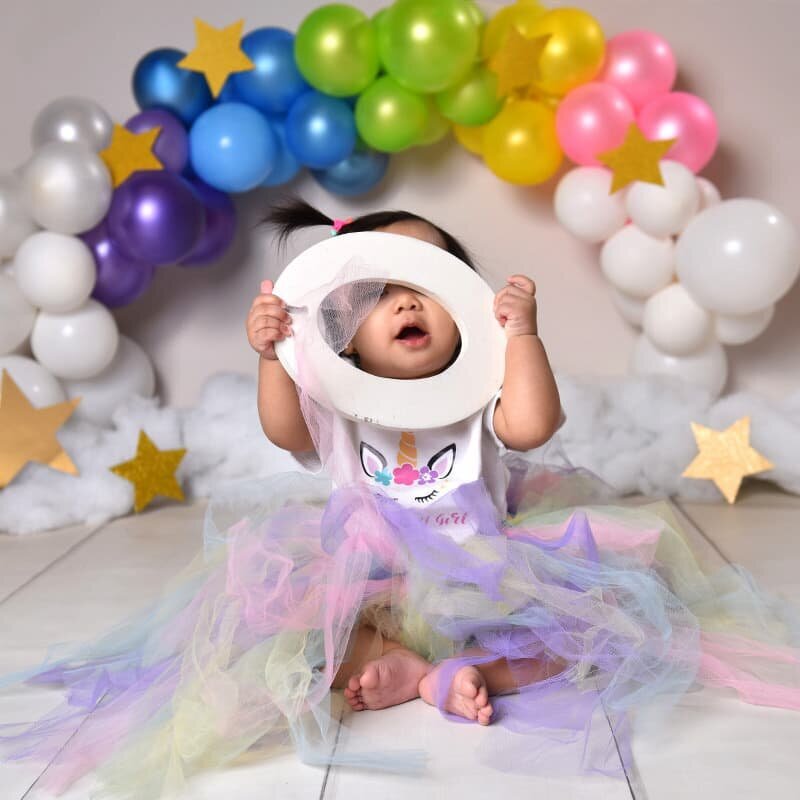 Cake smash session Milton — baby boy with frosting on his face