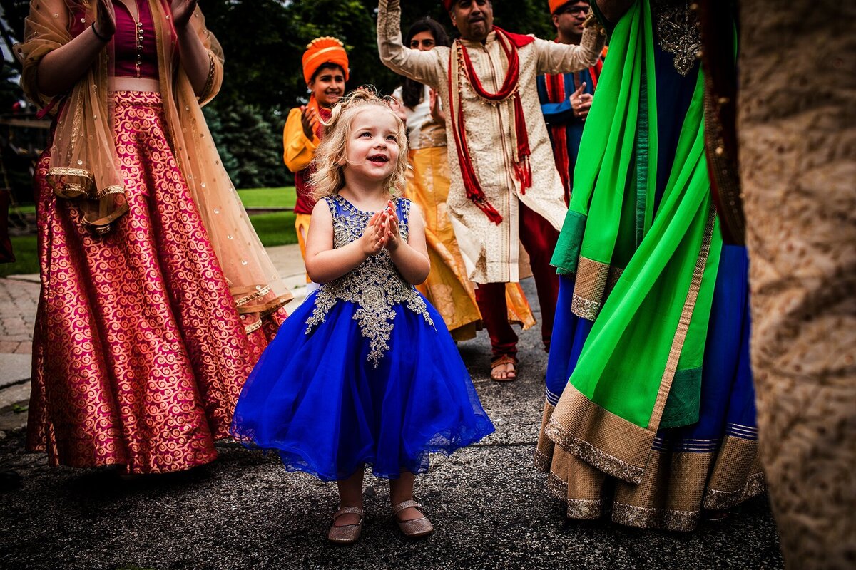 A girl dances during an Aurora Balaji temple wedding.