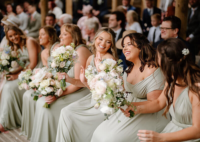 Bridesmaids holding bouquets 188