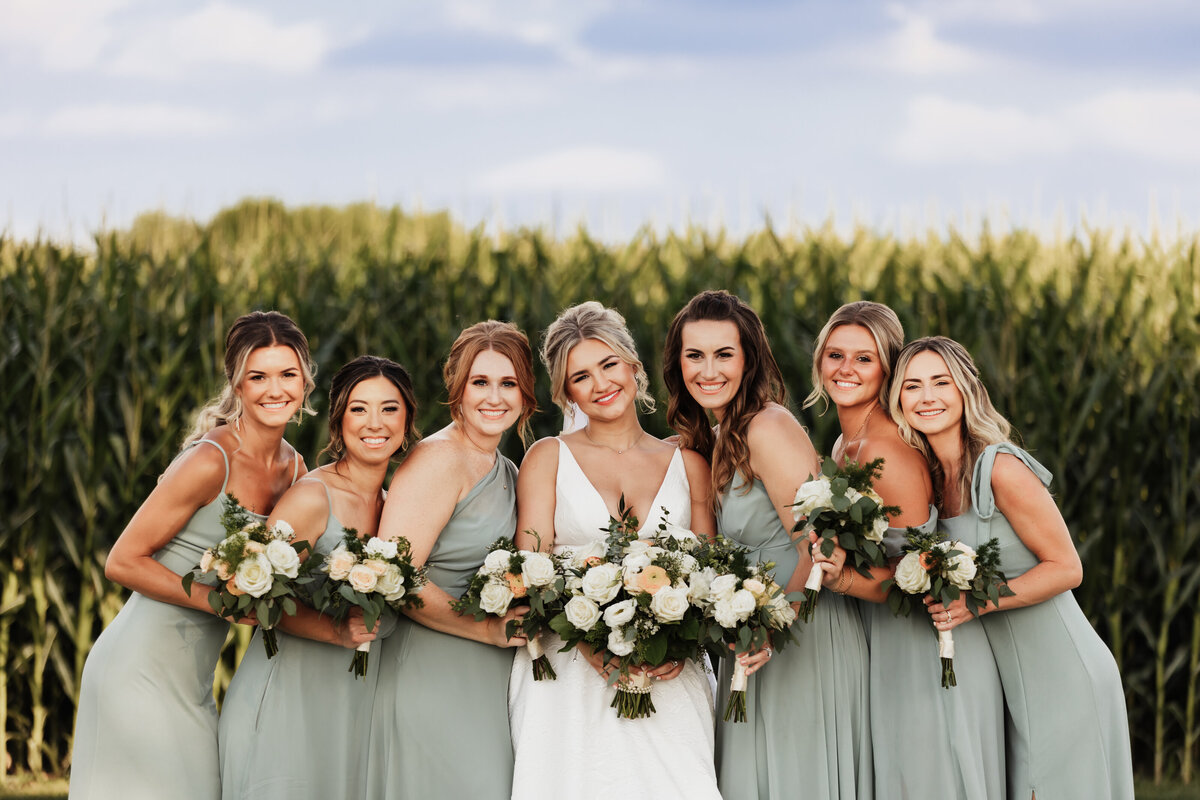 A portrait of a bride with her bridesmaids.