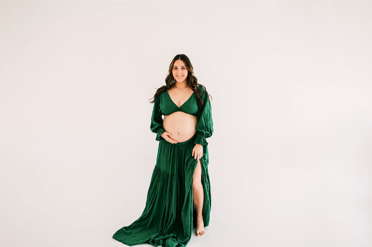 maternity photo in Springfield MO of pregnant mom smiling in studio